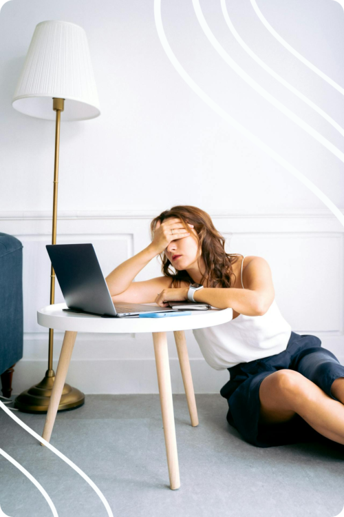 on the floor business woman frustrated at laptop