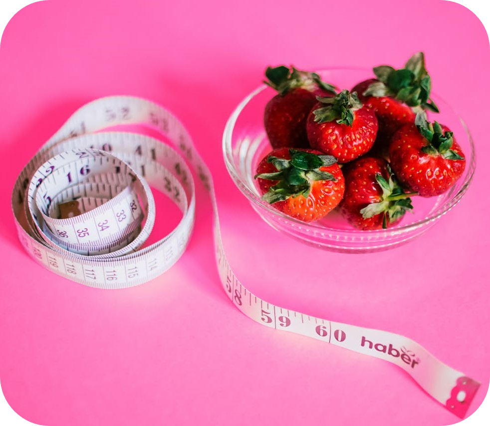 nutrition coach pink image with fruit and tape measure - business coaching client success stories