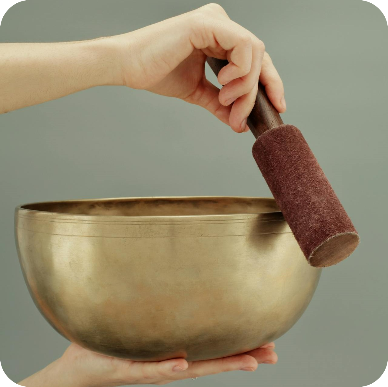 woman sound healer holding sound healing bowl - business coaching client success stories